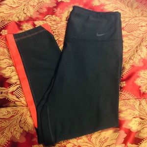 Nike Dri-Fit Capris. Black and Pinkish/Red mesh.